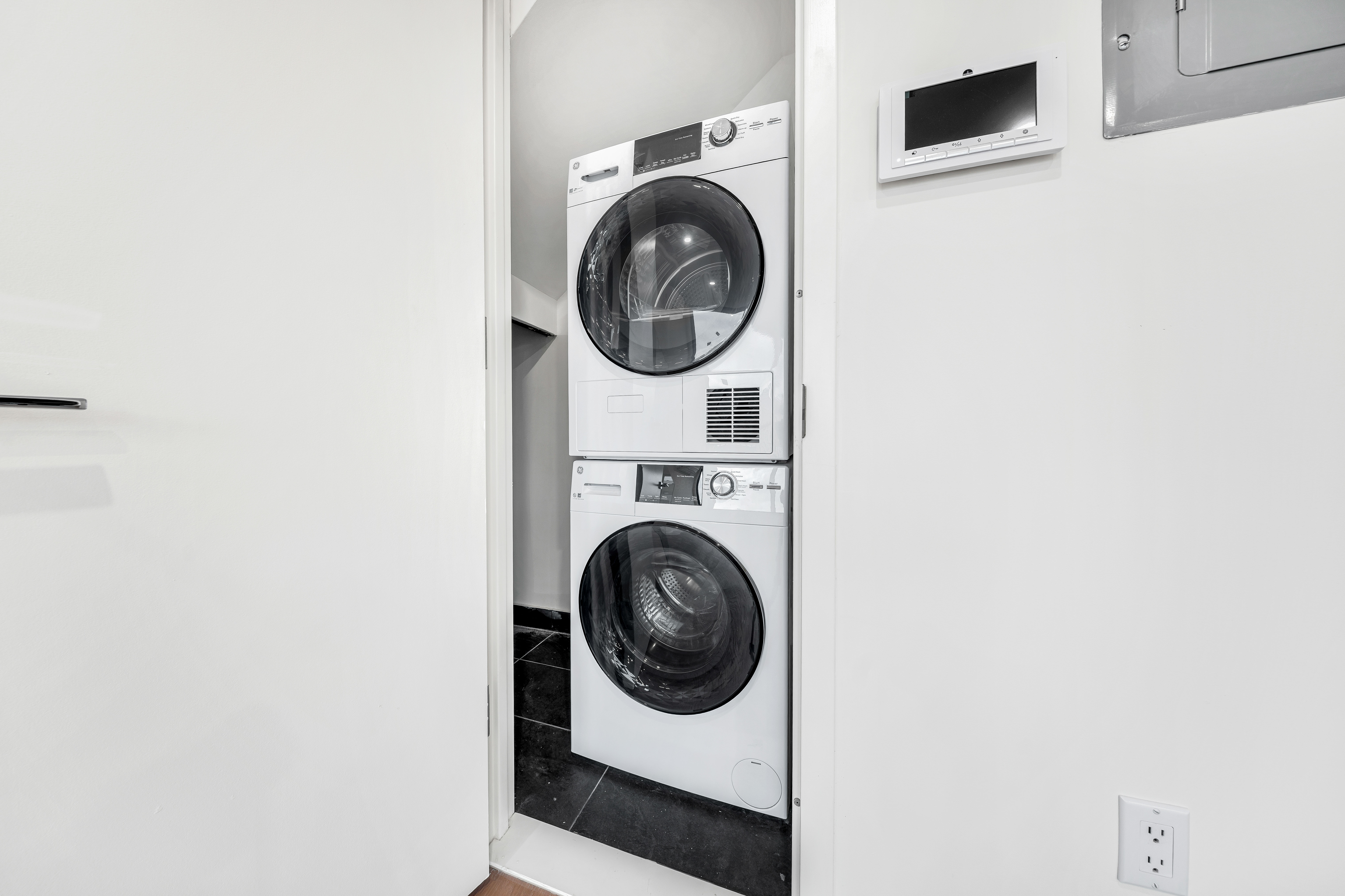 30-24 32nd Street, Unit 4A Queens, NY 11102 - Photo 15 of 22 a utility room with dryer and washer