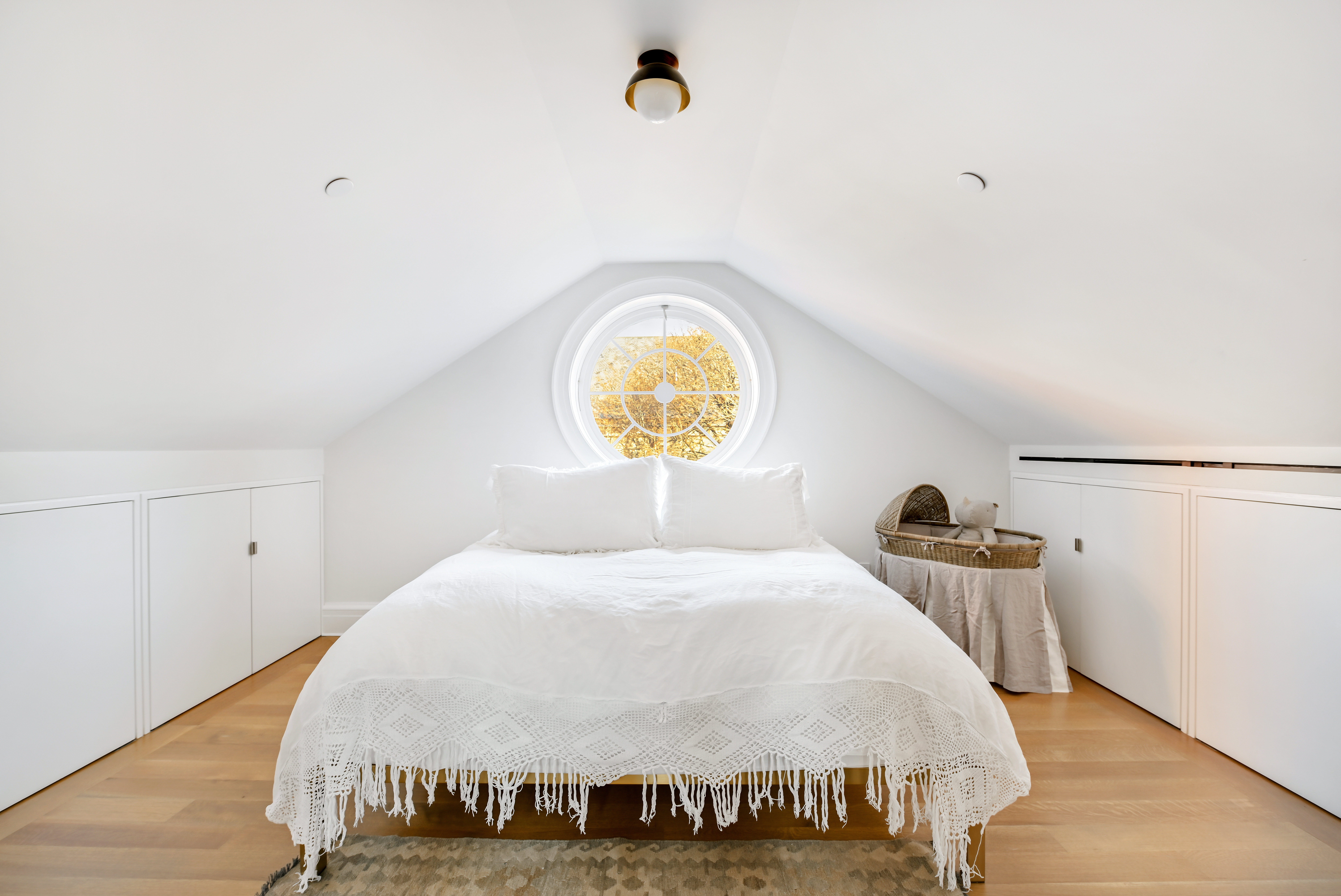 38 Prince Street Manhattan, NY 10012 - Photo 12 of 17 a bedroom with a bed and flowerpot