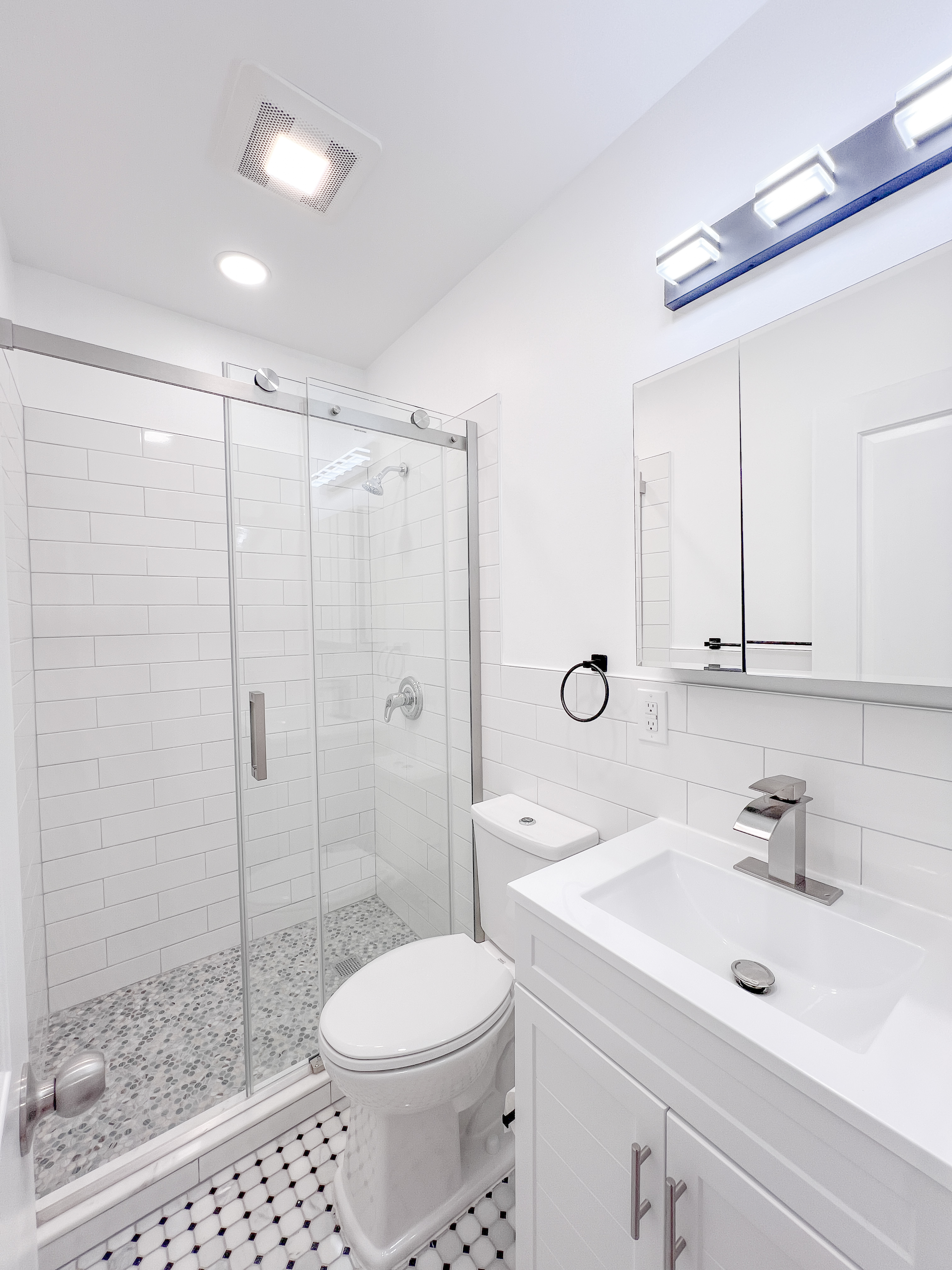 955 Pacific Street, Unit 1 Brooklyn, NY 11238 - Photo 6 of 12 a bathroom with a sink toilet and shower