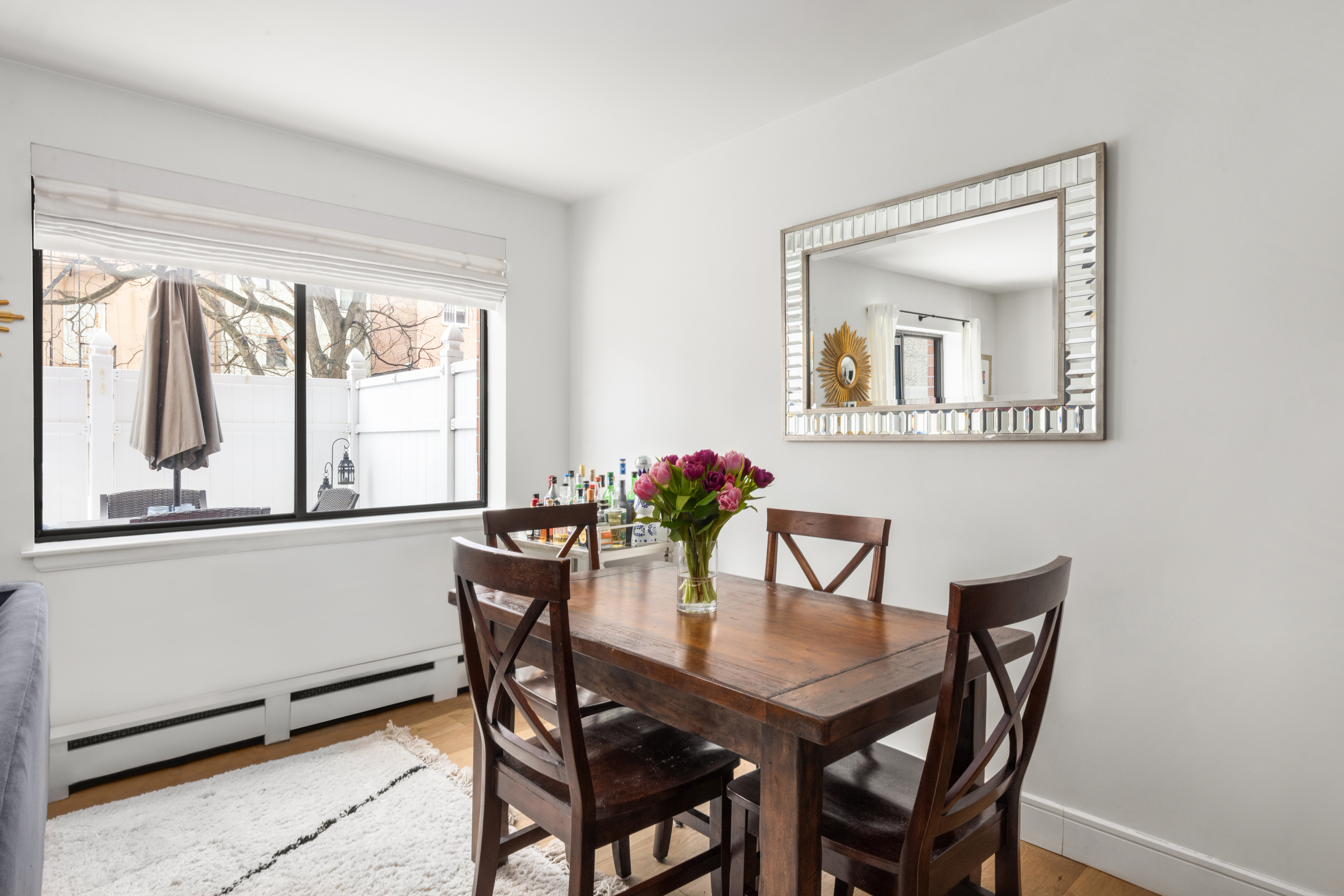 333 East 119th Street, Unit 1H Manhattan, NY 10035 - Photo 8 of 17 a dining room with furniture and window