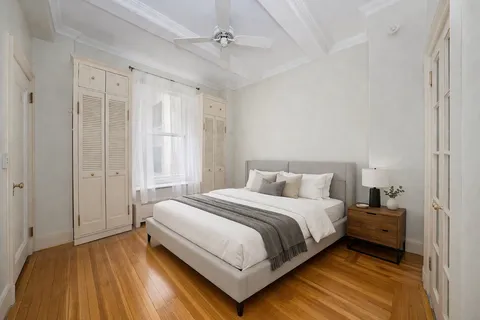 a bedroom with a bed and a walk in closet