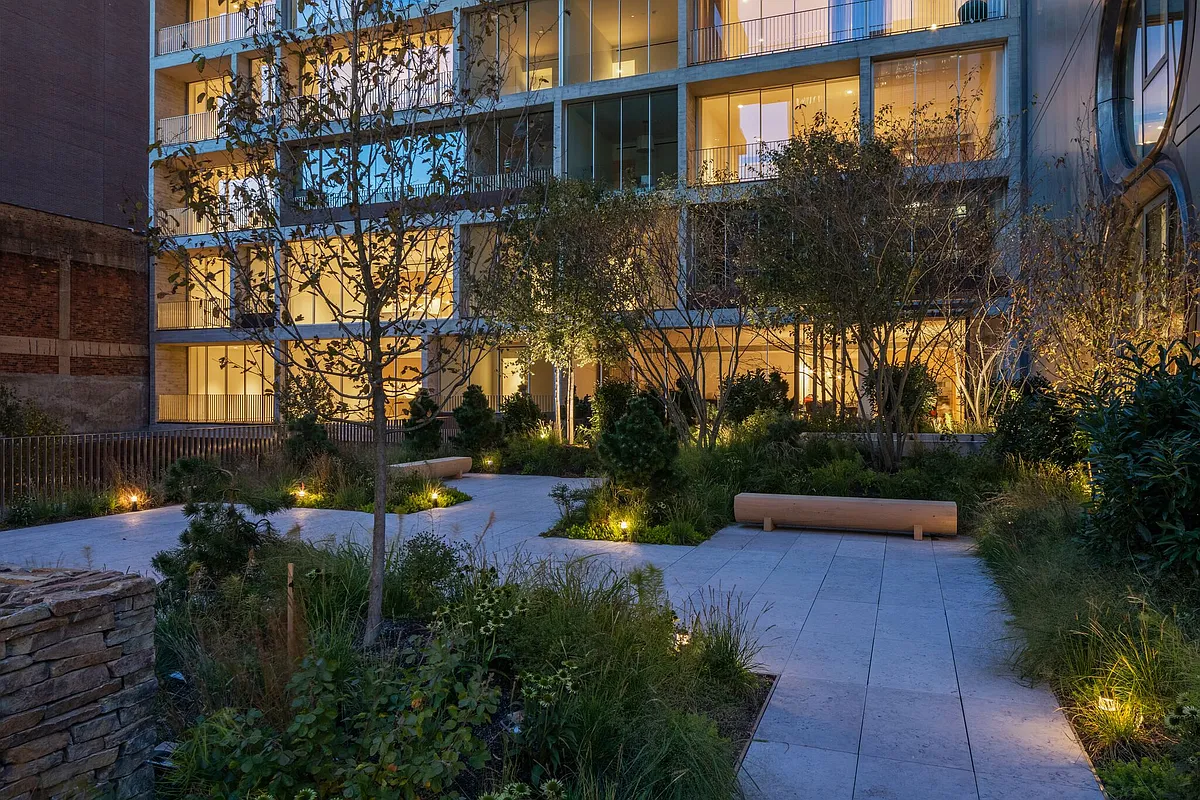 527 West 27th Street, Unit 4C Manhattan, NY 10001 - Photo 16 of 25 a view of a house with a yard