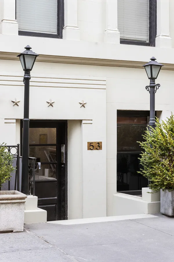 a potted plant sitting on the side of a building