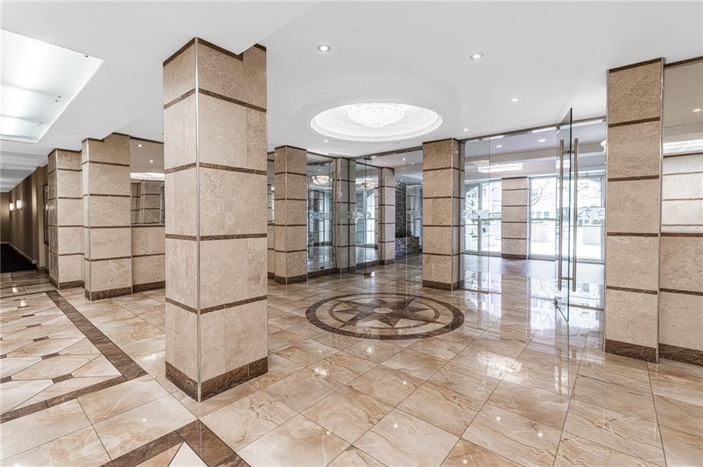 135 Oceana Drive East, Unit 2C Brooklyn, NY 11235 - Photo 14 of 29 a bathroom with a sink and a mirror