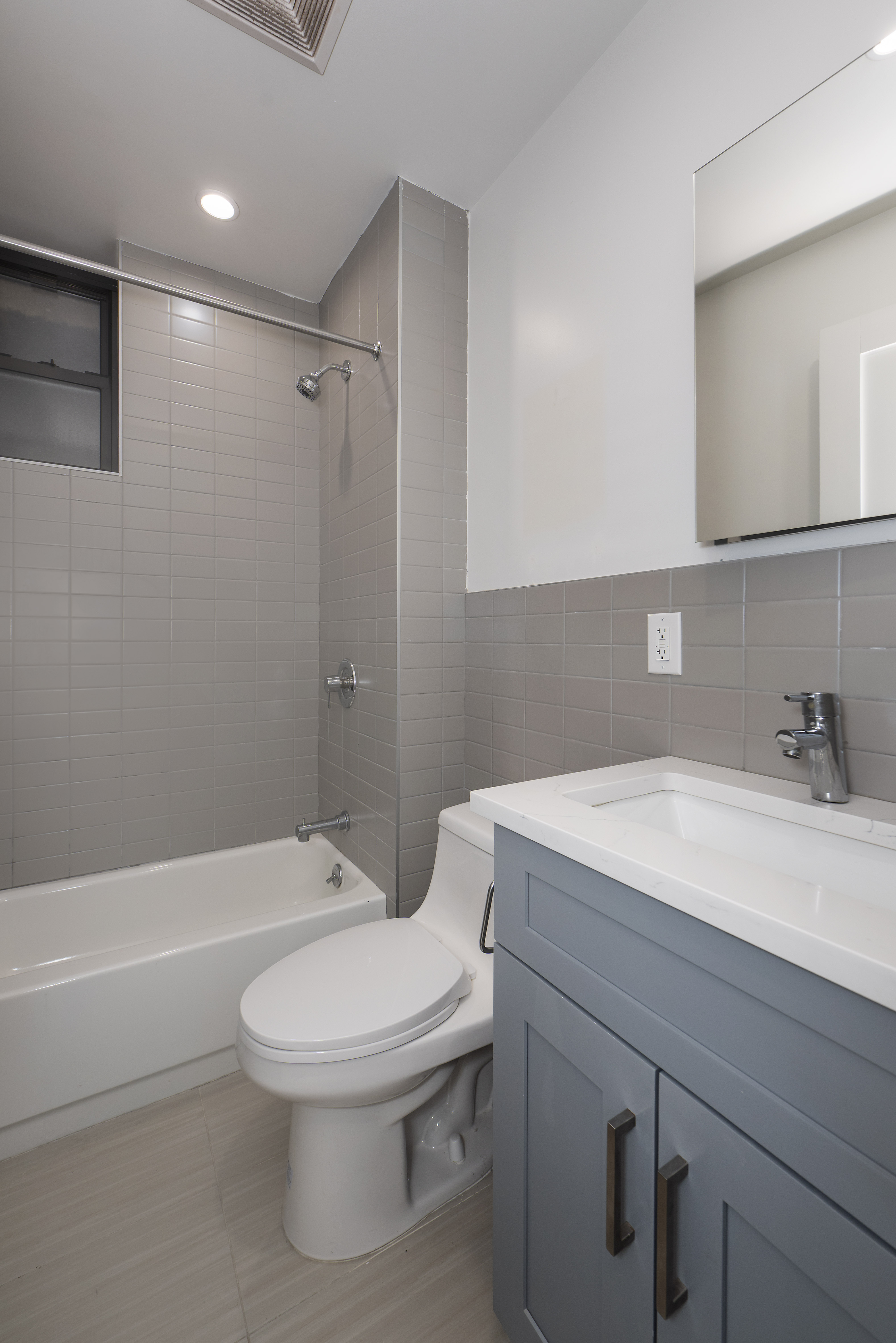 129 2nd Avenue, Unit 8 Manhattan, NY 10003 - Photo 8 of 11 a bathroom with a sink a toilet and shower
