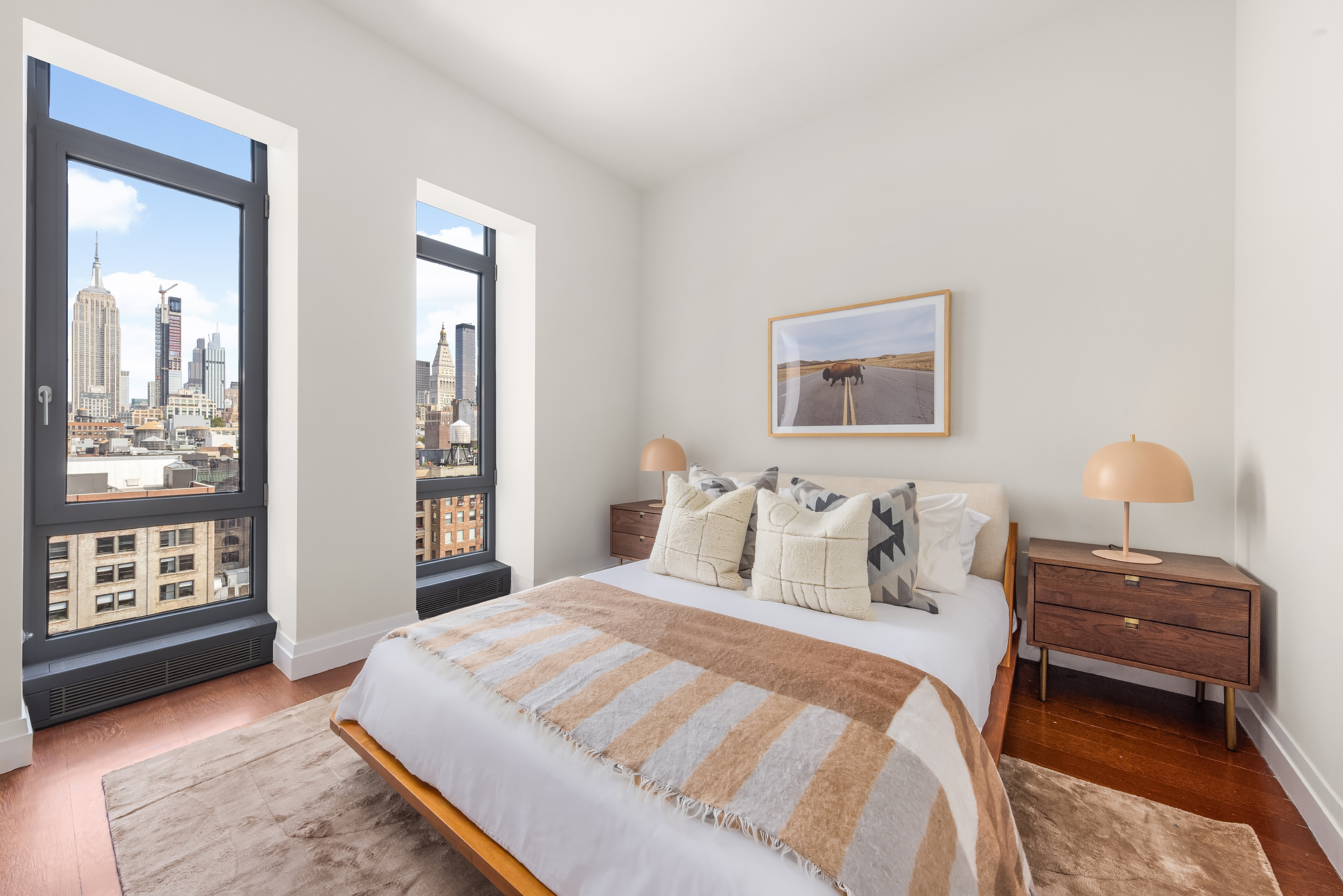35 West 15th Street, Unit 15D Manhattan, NY 10011 - Photo 11 of 15 a bedroom with a bed and with windows