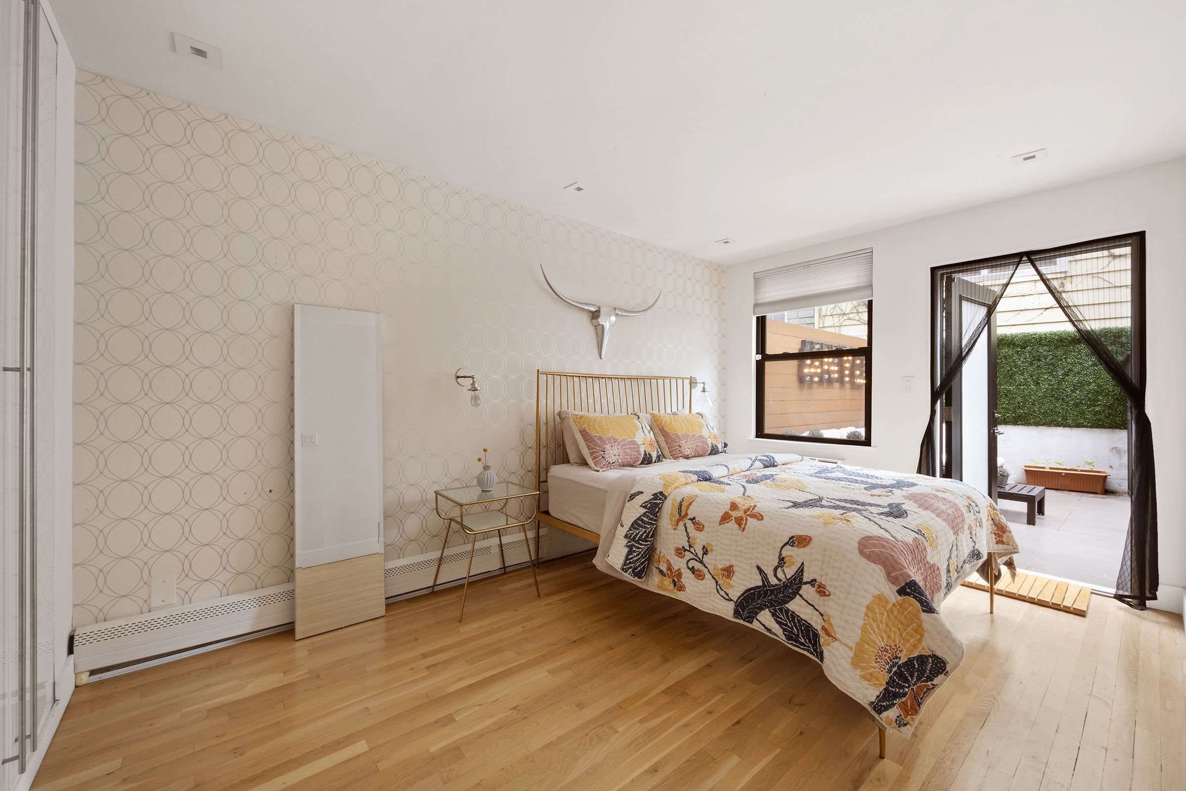 138 North 3rd Street, Unit 1 Brooklyn, NY 11249 - Photo 4 of 8 a bedroom with a bed and a window