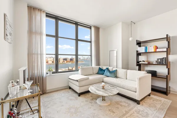a living room with furniture and a window