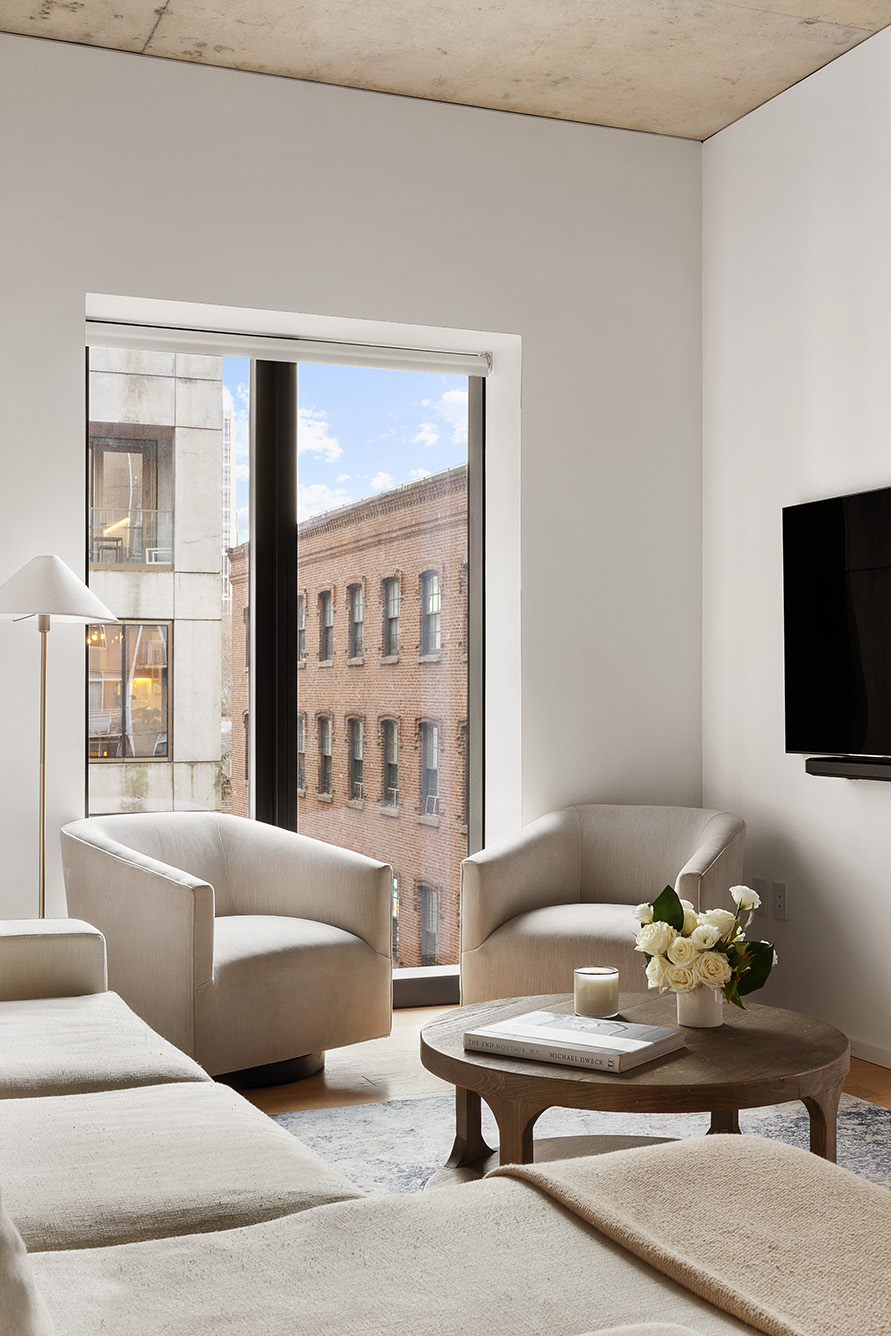 98 Front Street, Unit 8T Brooklyn, NY 11201 - Photo 5 of 18 a living room with furniture window and a flat screen tv