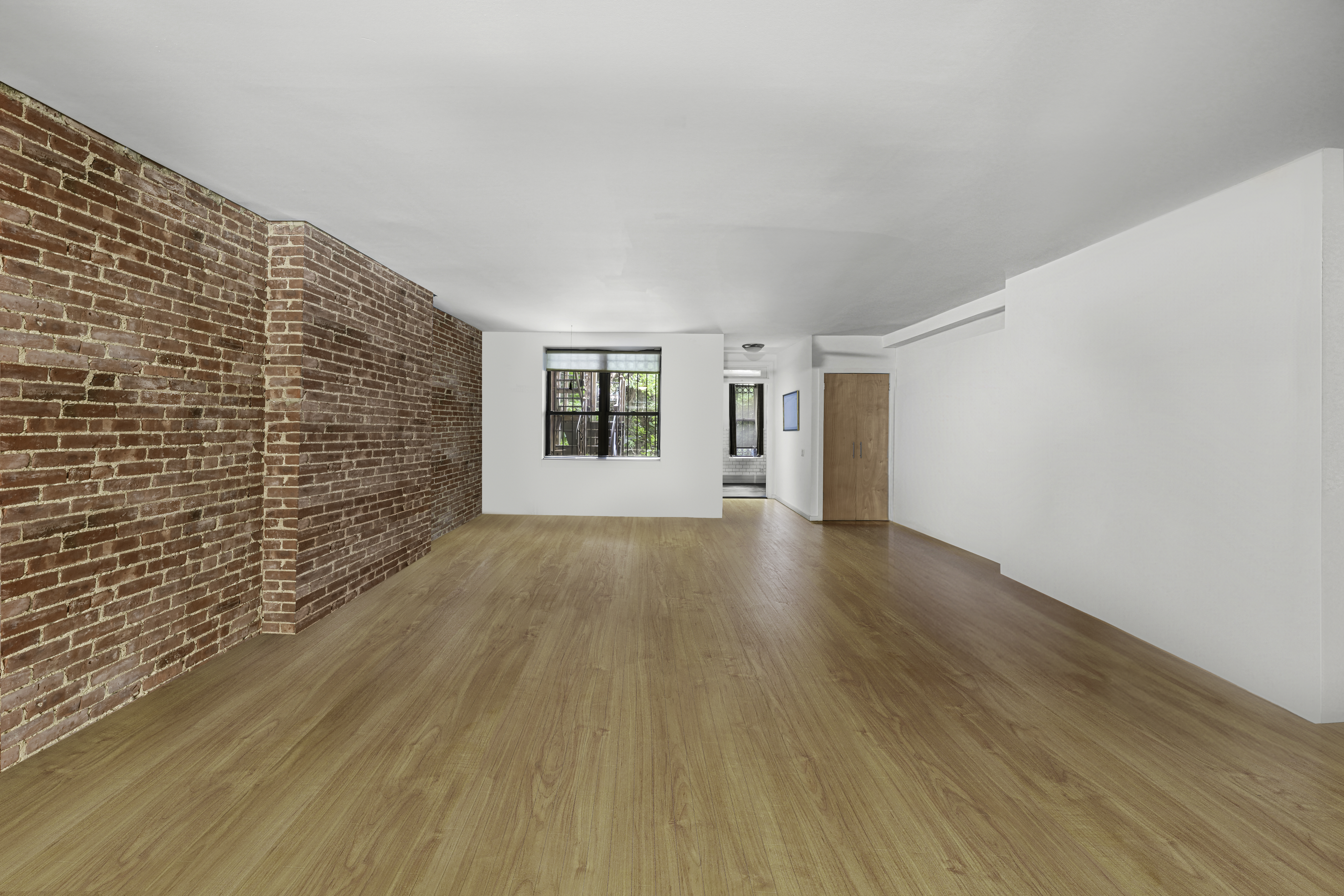 109 West 118th Street Manhattan, NY 10026 - Photo 22 of 31 a view of an empty room with wooden floor and a window