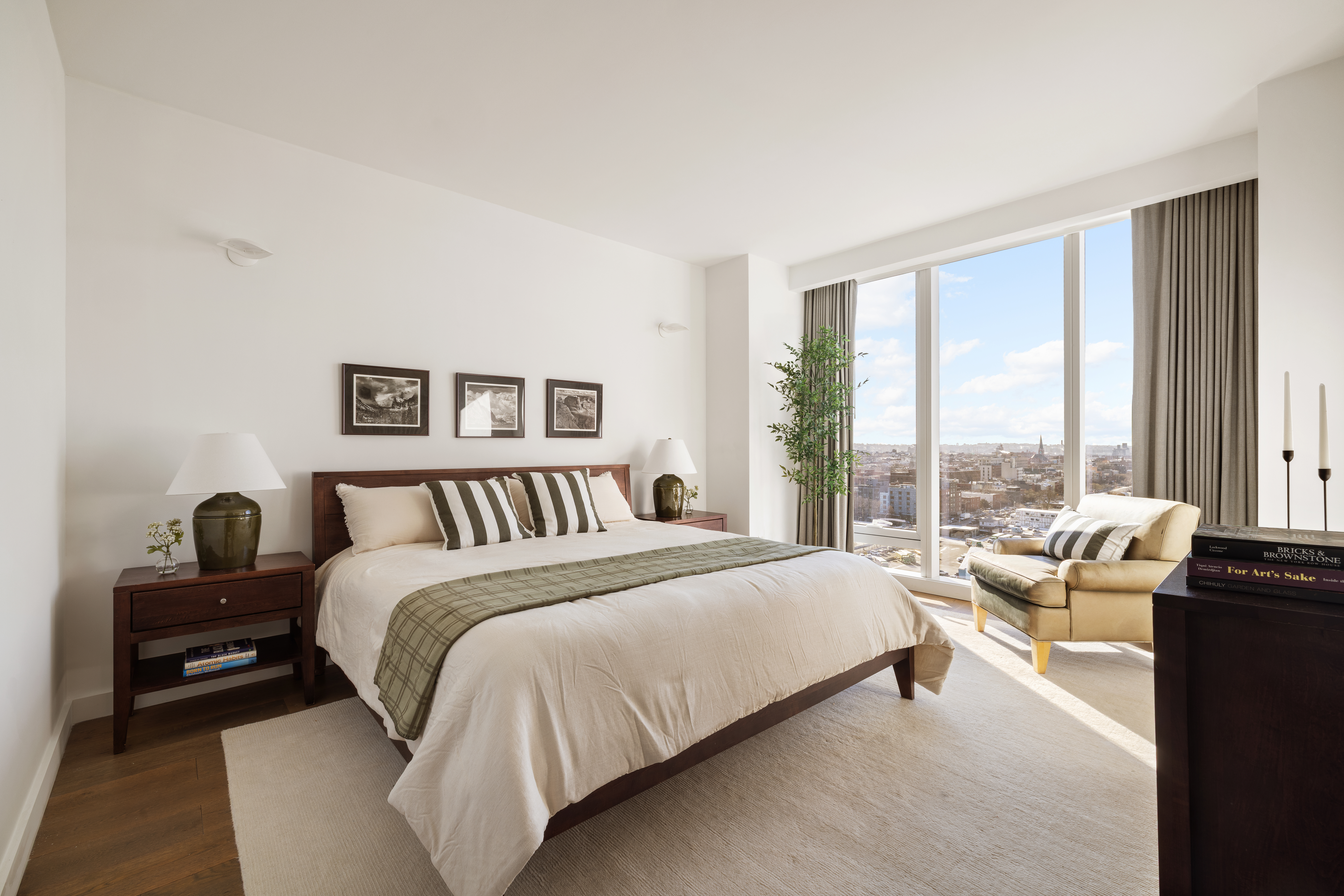 50 Bridge Park Drive, Unit 16E Brooklyn, NY 11201 - Photo 7 of 15 a bedroom with a bed and a large window