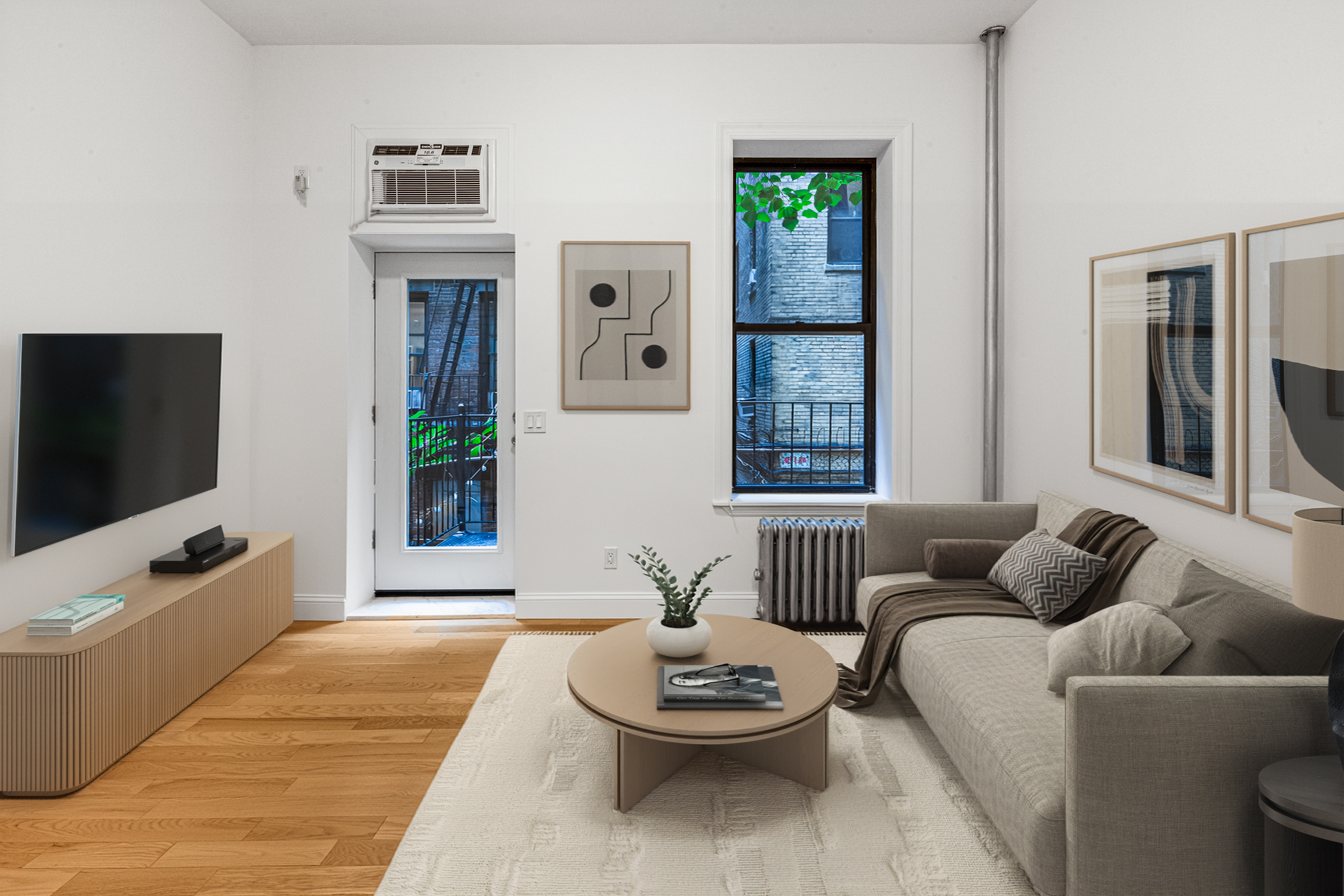 304 East 11th Street, Unit 1C Manhattan, NY 10003 - Photo 1 of 16 a living room with furniture and a flat screen tv