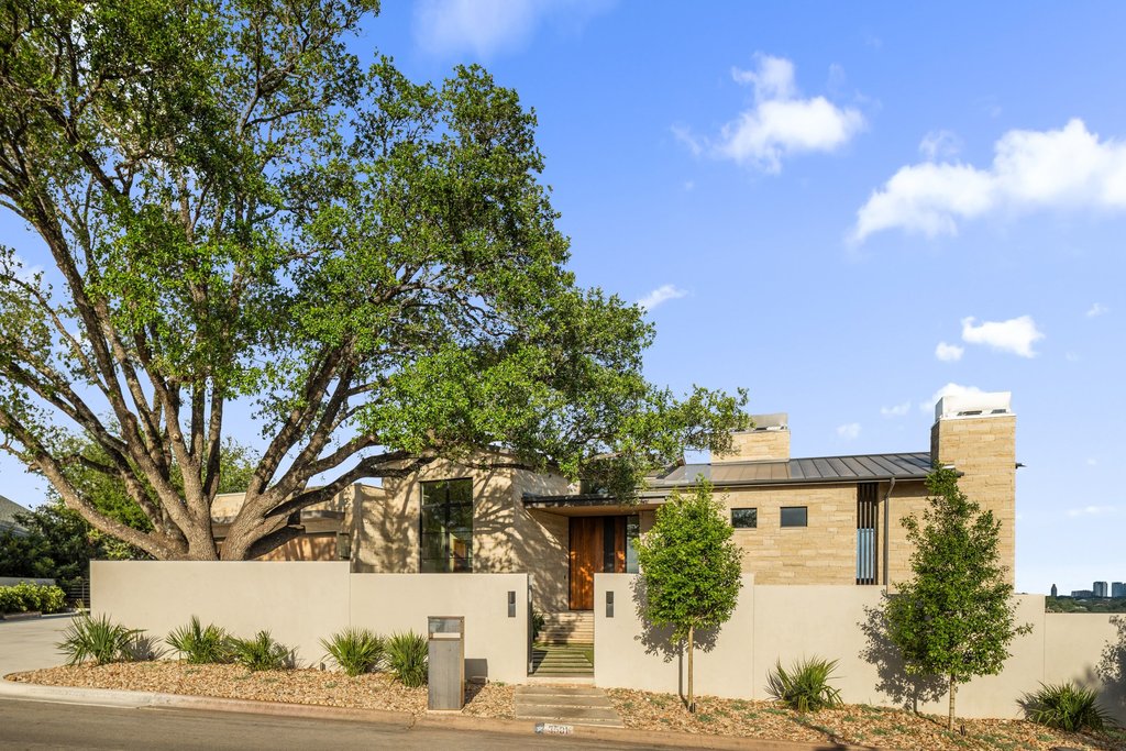 Mt Bonnell Road Austin, TX 78731 - Photo 4 of 51 a front view of a house with a yard and garage