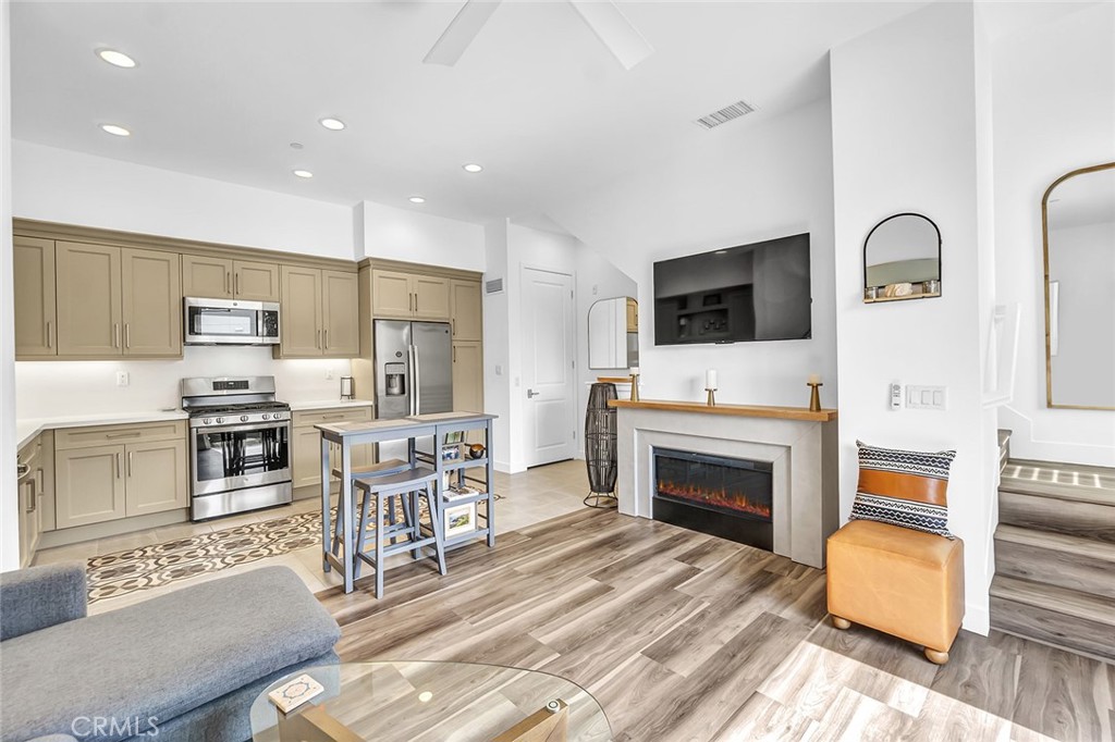 1632 Doheny Way Dana Point, CA 92629 - Photo 4 of 33 a living room with furniture a flat screen tv and a fireplace