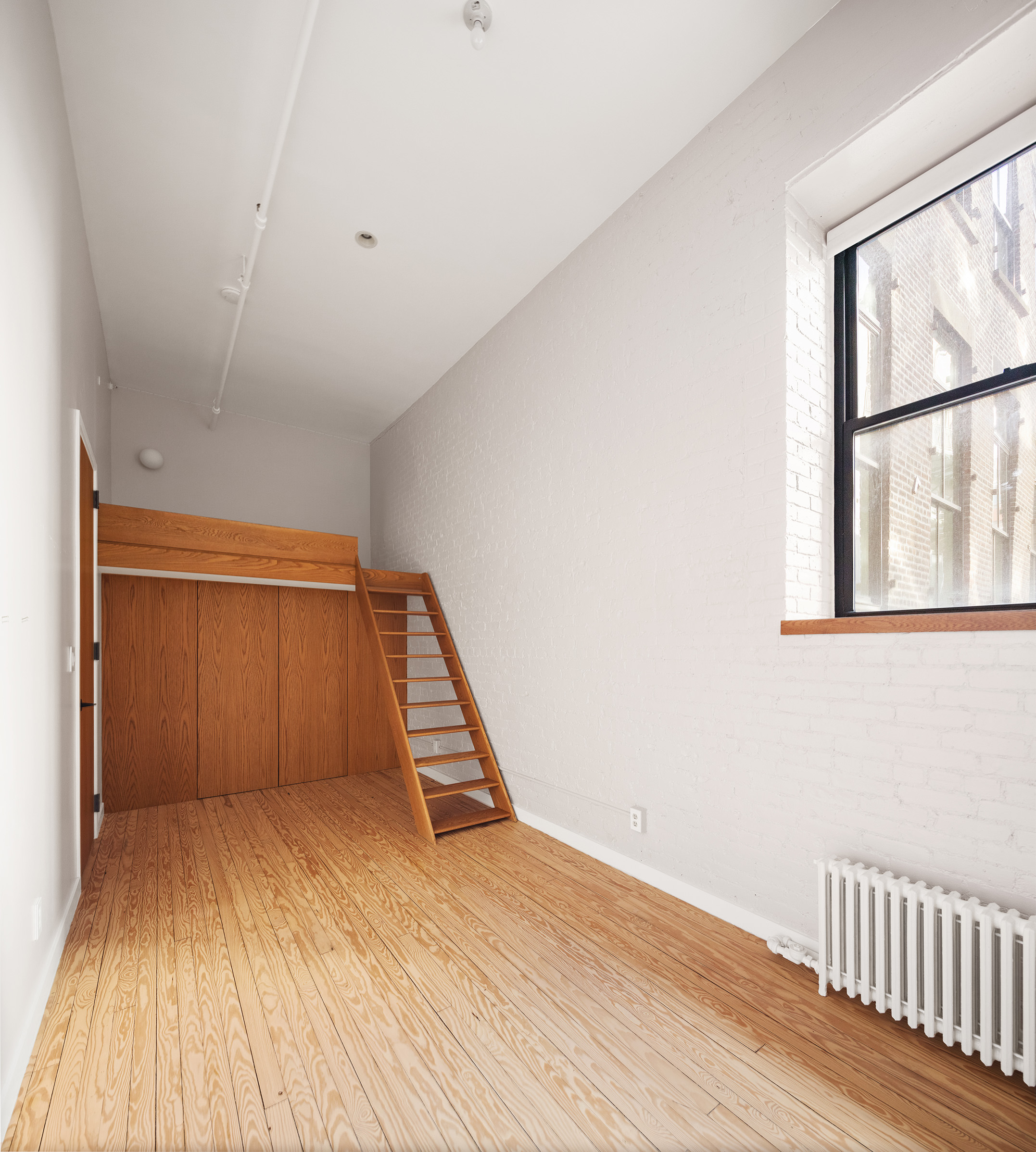 169 Mercer Street, Unit 2 Manhattan, NY 10012 - Photo 7 of 10 a view of wooden floor in a room