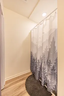 a bedroom with furniture and large window