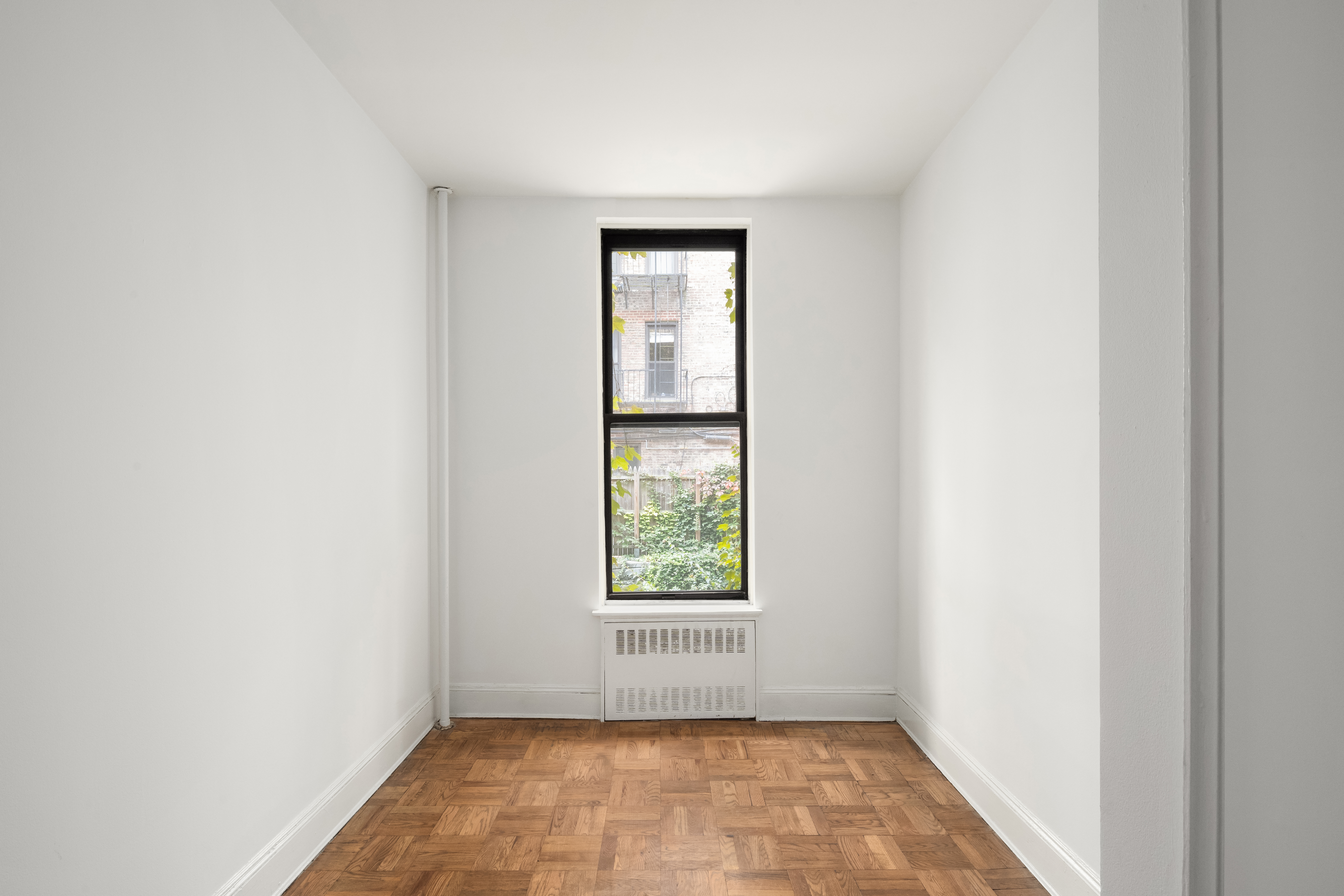 130 West 80th Street, Unit 2R Manhattan, NY 10024 - Photo 3 of 8 a view of an empty room with a window