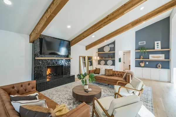 a living room with furniture and a fireplace