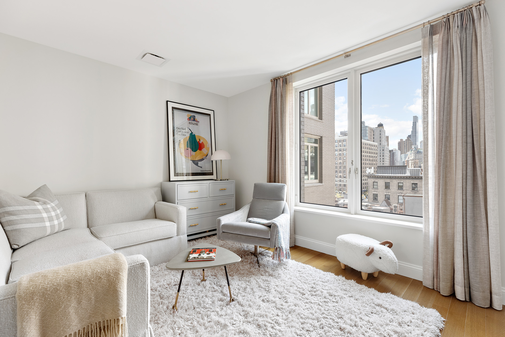 250 West 81st Street, Unit 8B Manhattan, NY 10024 - Photo 6 of 19 a living room with furniture and a window with outer view