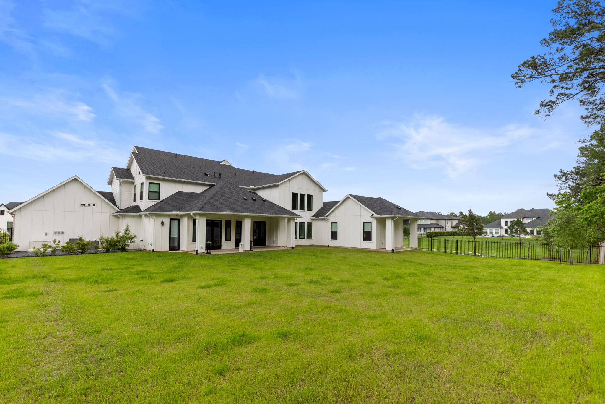 2118 Bennet Court Conroe, TX 77384 - Photo 61 of 70 a view of a house with a big yard and large trees