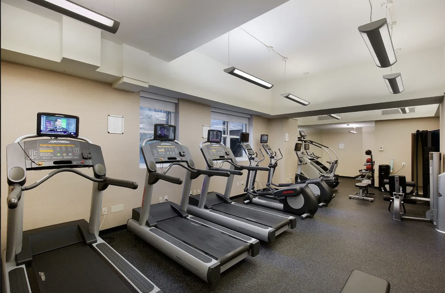 155 West 68th Street, Unit 1518 Manhattan, NY 10023 - Photo 8 of 10 a room with gym equipment