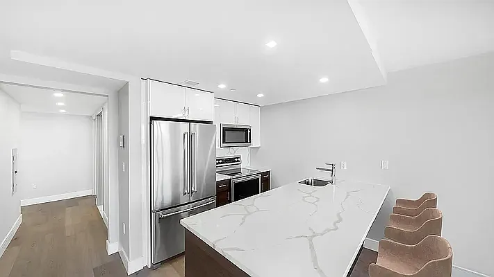 605 Hart Street, Unit 6E Brooklyn, NY 11221 - Photo 1 of 10 a kitchen with stainless steel appliances a refrigerator and microwave