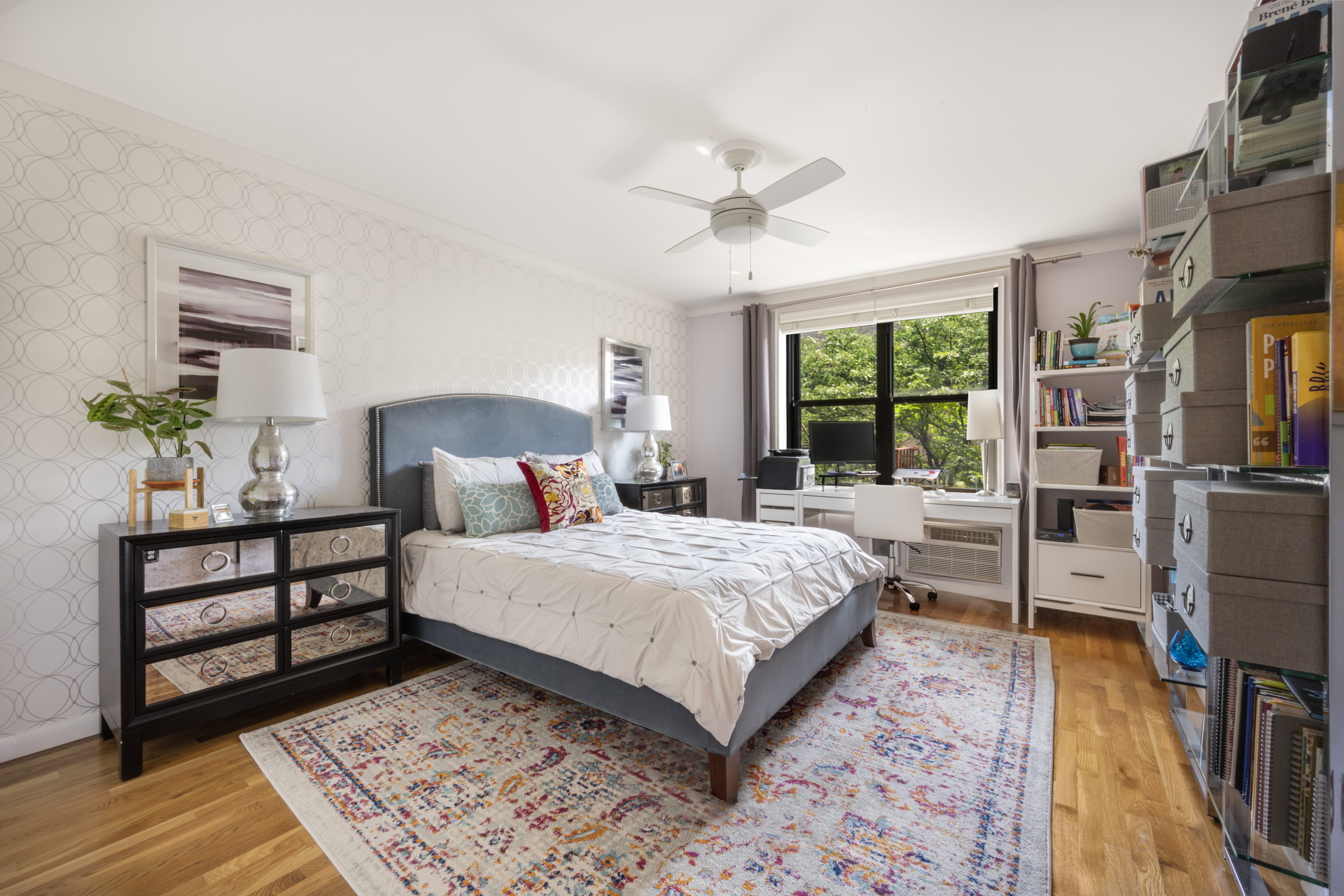 45 Overlook Terrace, Unit 4E Manhattan, NY 10033 - Photo 3 of 17 a bedroom with a bed furniture and a large window