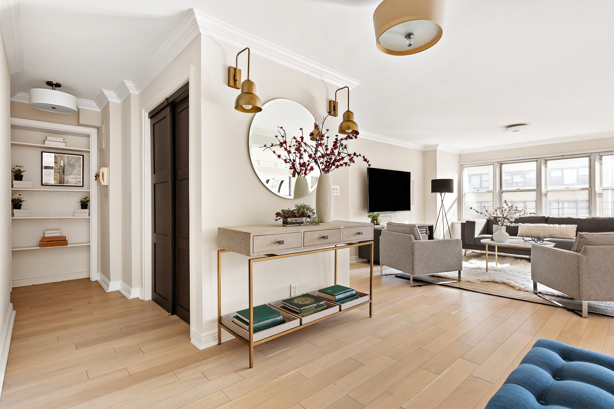 155 East 38th Street, Unit 12K Manhattan, NY 10016 - Photo 3 of 15 a living room with furniture flat screen tv and a fireplace