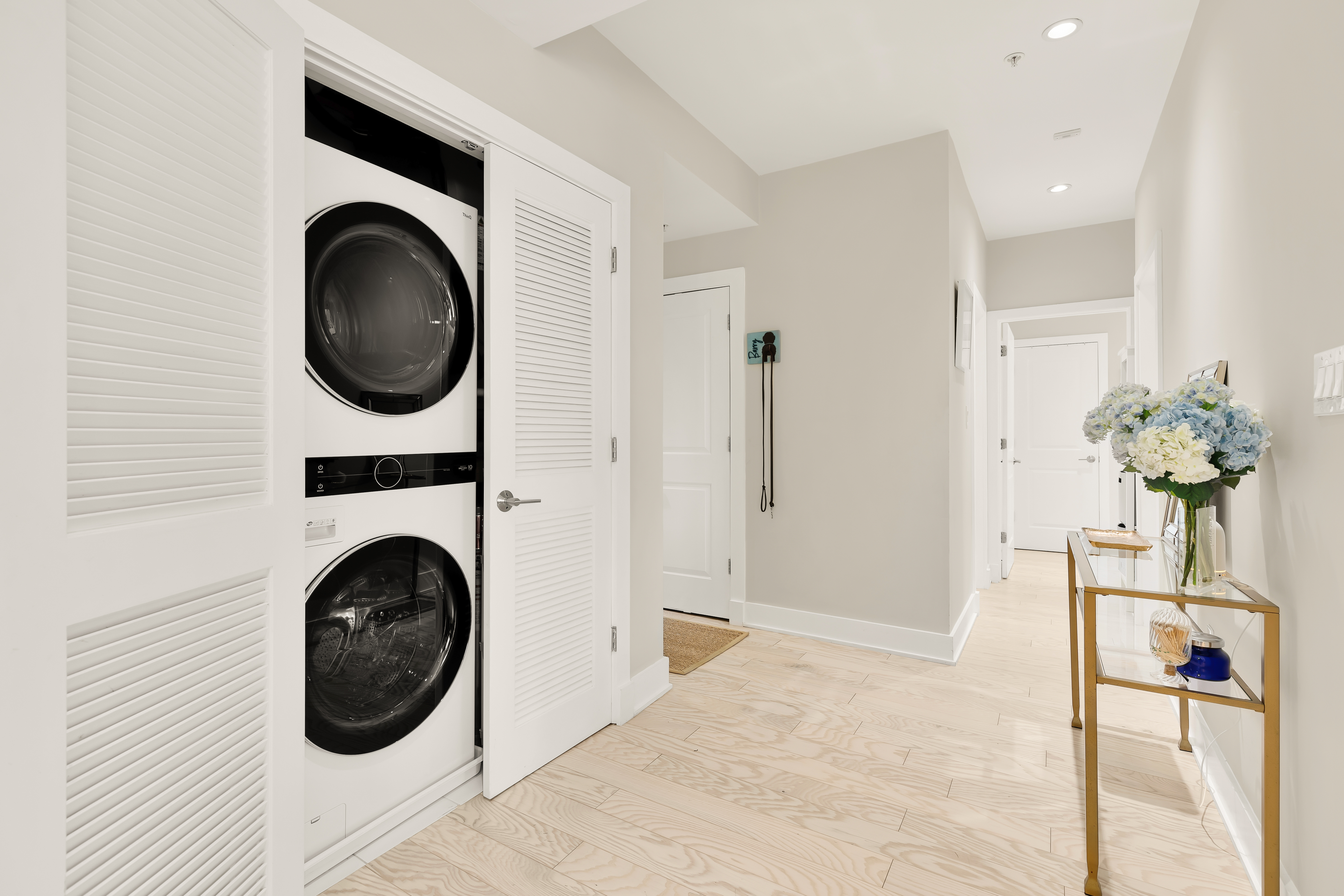 2101 11th Street Northwest, Unit 403 Washington, DC 20001 - Photo 14 of 30 a view of a hallway with washer and dryer
