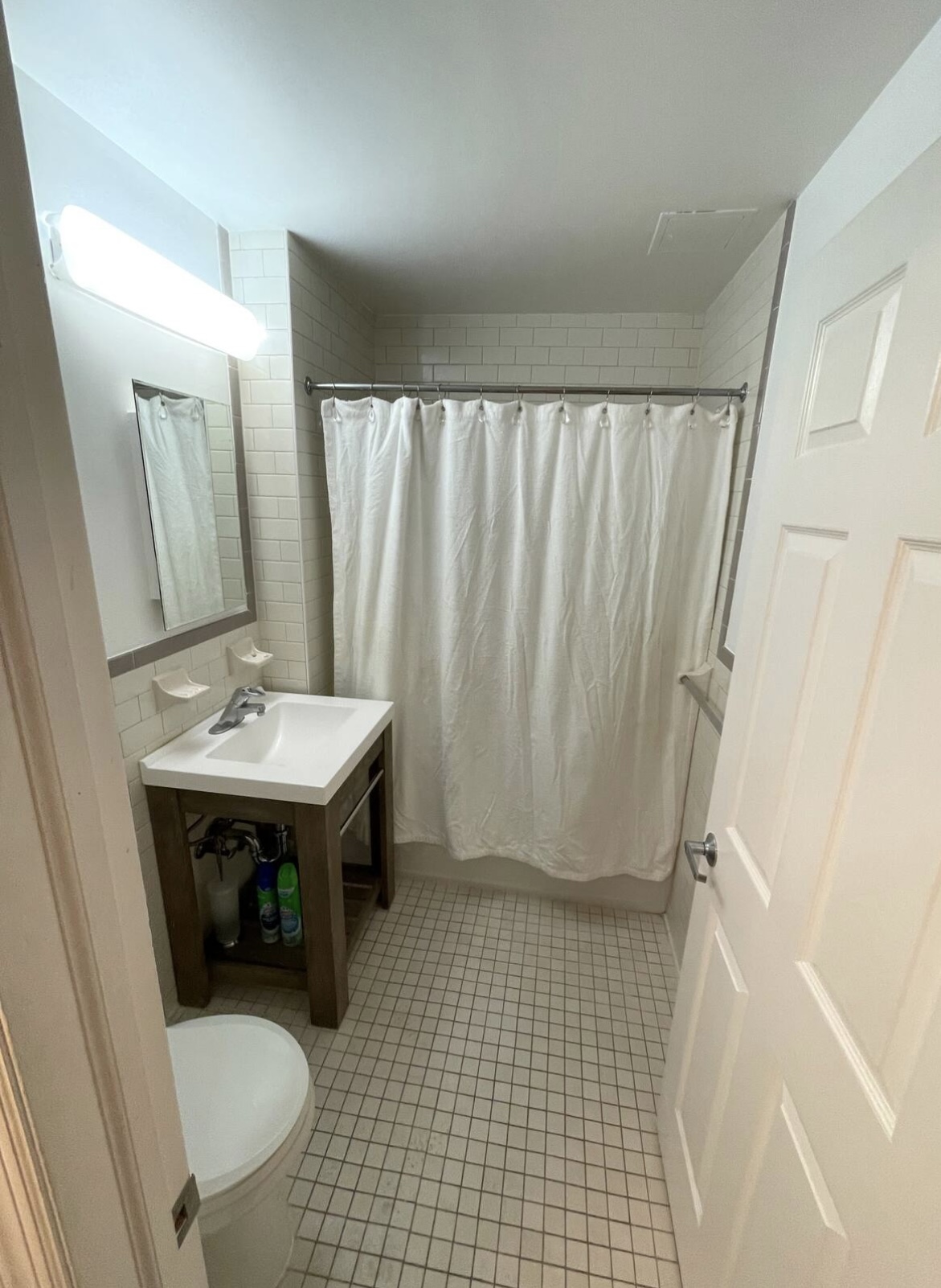 2073 Adam Clayton Powell Jr Boulevard, Unit 4 Manhattan, NY 10027 - Photo 7 of 10 a bathroom with a sink a toilet and shower