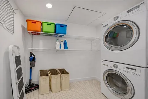 a utility room with sink dryer and washer