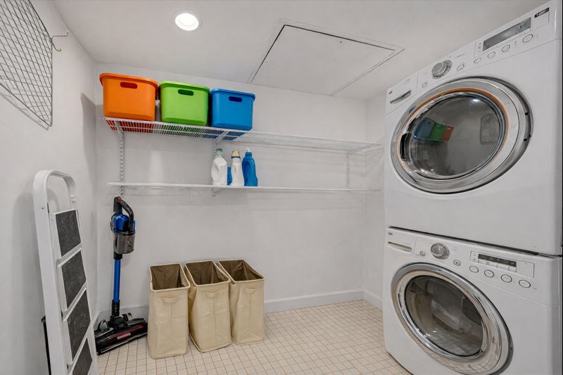 133 West 14th Street, Unit 1 Manhattan, NY 10011 - Photo 15 of 17 a utility room with sink dryer and washer