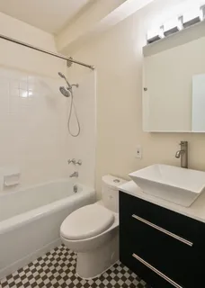 a bathroom with a sink a toilet and a bathtub