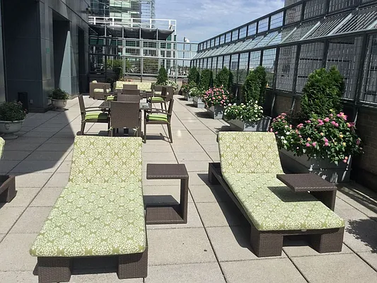 301 West 57th Street, Unit 22E Manhattan, NY 10019 - Photo 12 of 13 a view of a patio with couches table and chairs and potted plants