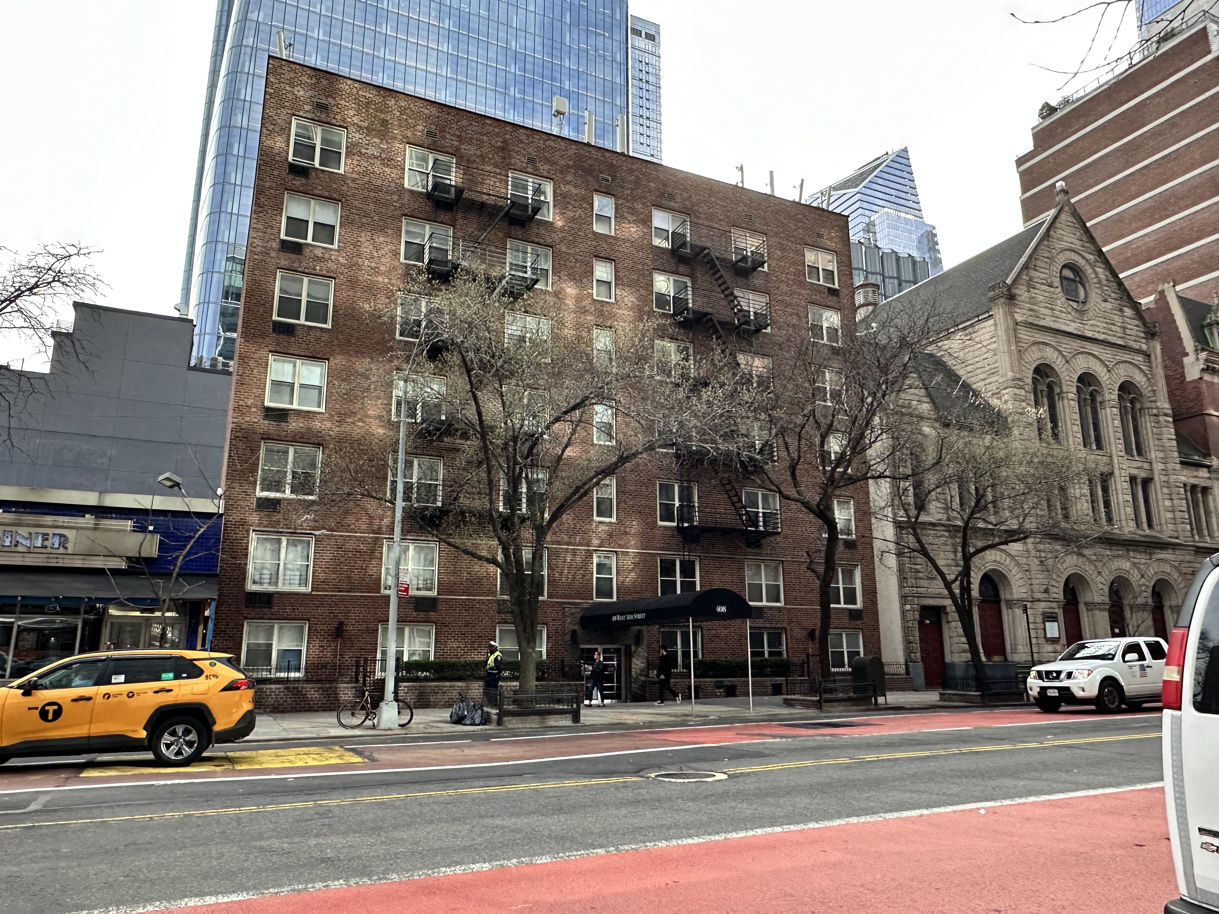 408 West 34th Street, Unit 1F Manhattan, NY 10001 - Photo 12 of 13 a cars parked in front of a building
