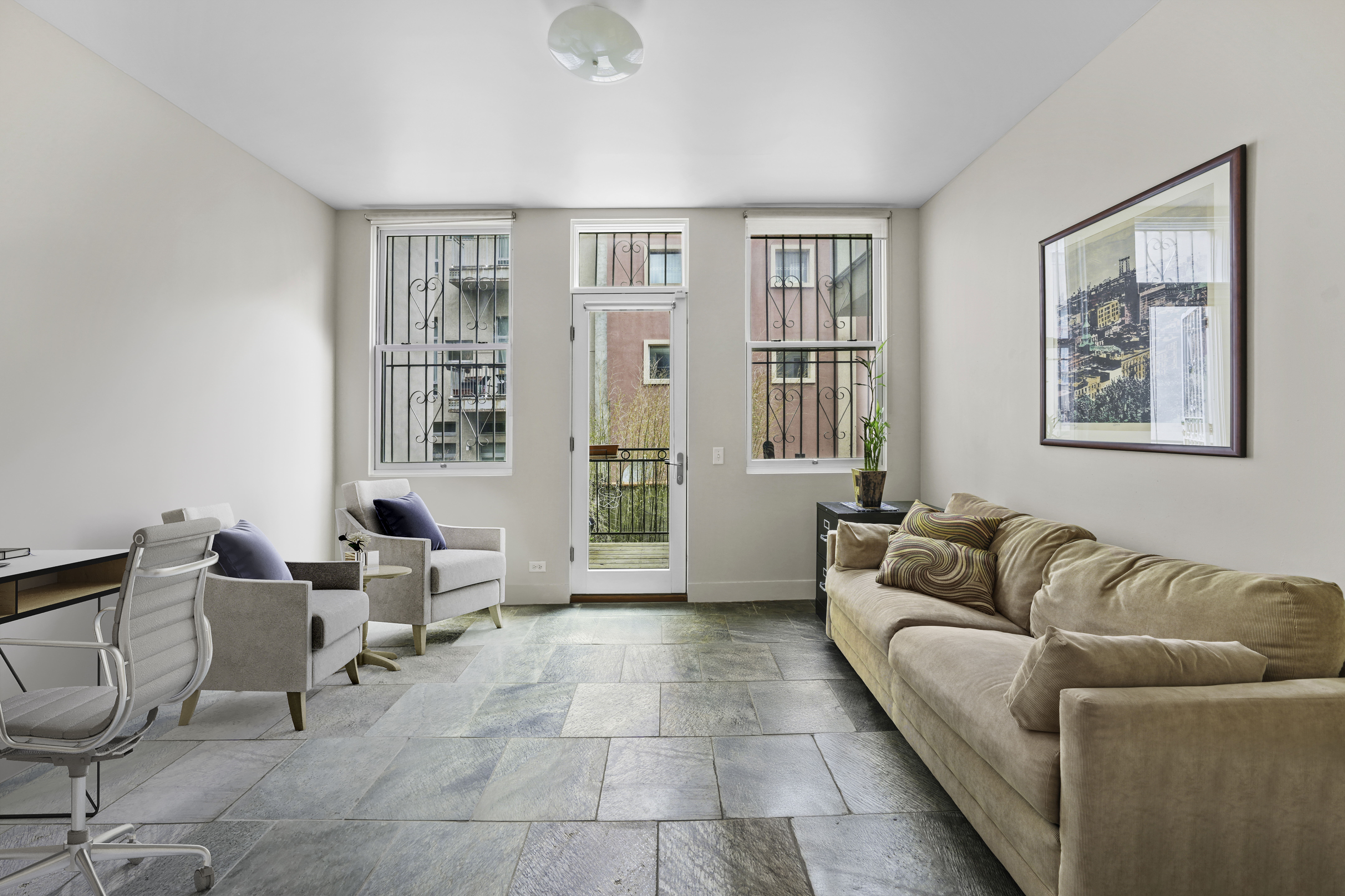 133 West 123rd Street Manhattan, NY 10027 - Photo 14 of 31 a living room with furniture and a window