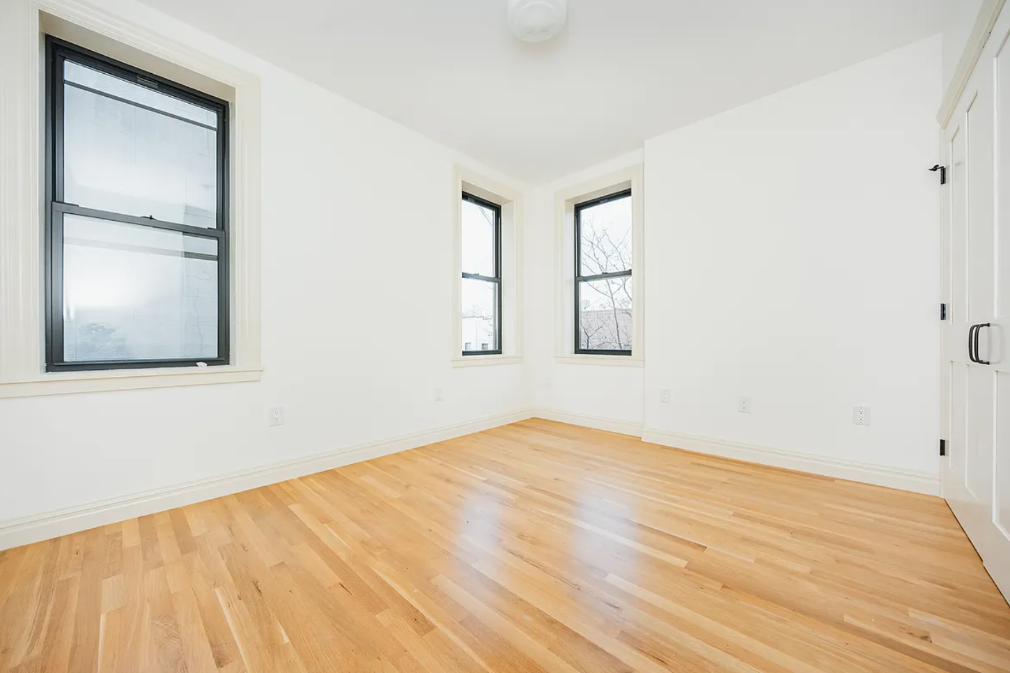 68-38 Forest Avenue, Unit 3R Queens, NY 11385 - Photo 9 of 15 an empty room with a window