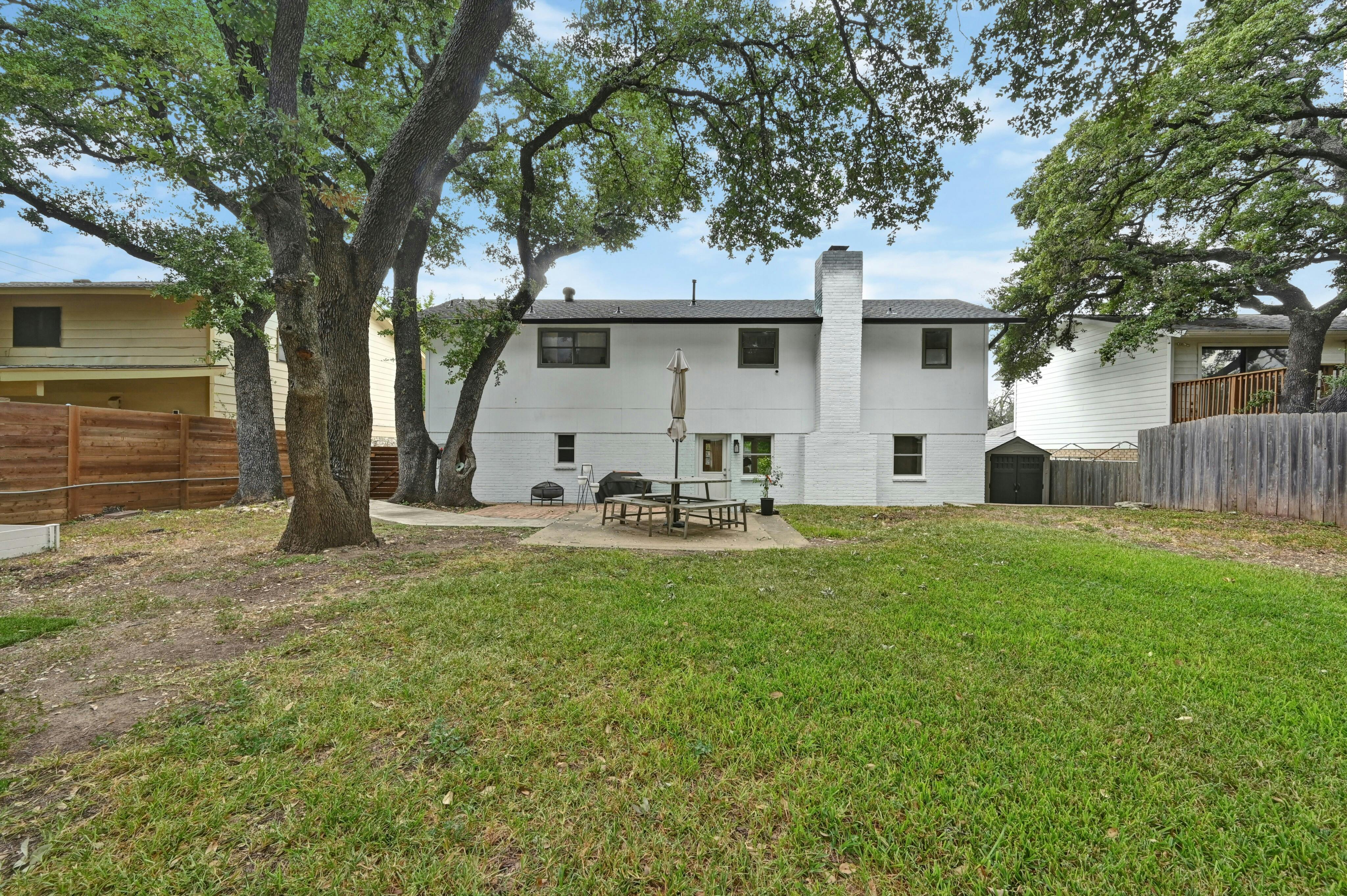 Address Upon Request Austin, TX 78745 - Photo 17 of 19 a view of a white house with a big yard and large tree