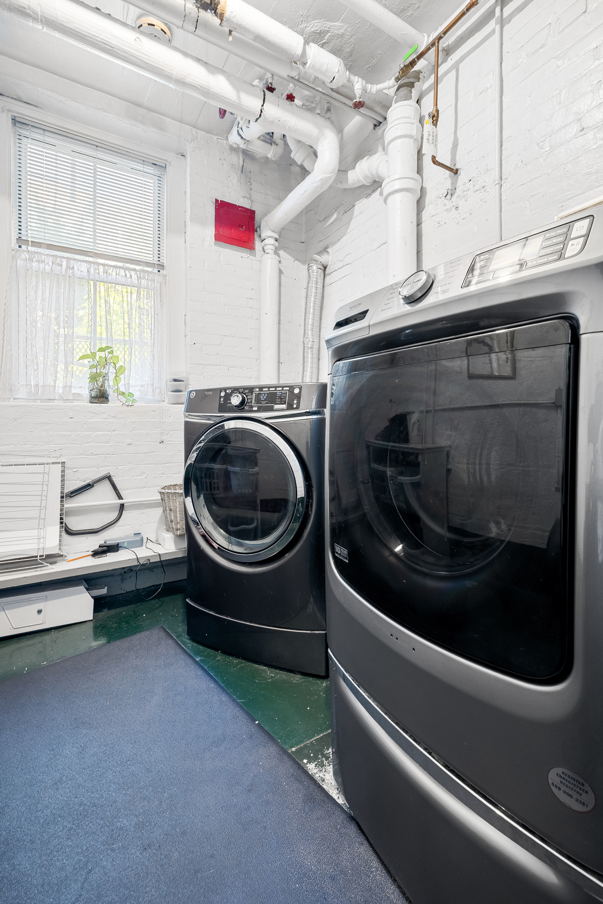 35-27 76th Street, Unit 21 Queens, NY 11372 - Photo 19 of 24 a utility room with dryer and washer