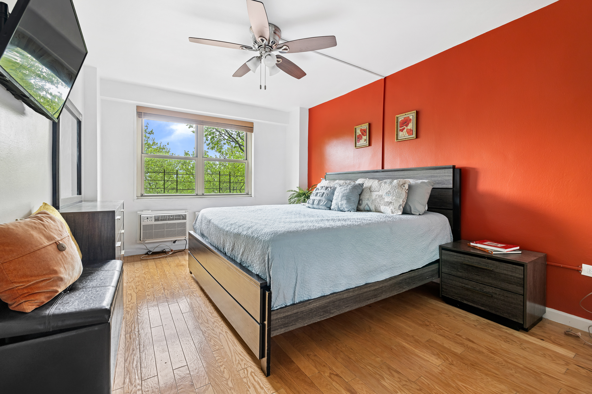 1065 Vermont Street, Unit 4L Brooklyn, NY 11207 - Photo 5 of 11 a bedroom with a bed and a flat screen tv