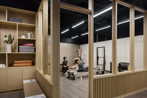 a view of a hallway to a livingroom with furniture and floor to ceiling window
