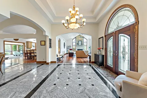 a living room with fireplace furniture and a wooden floor