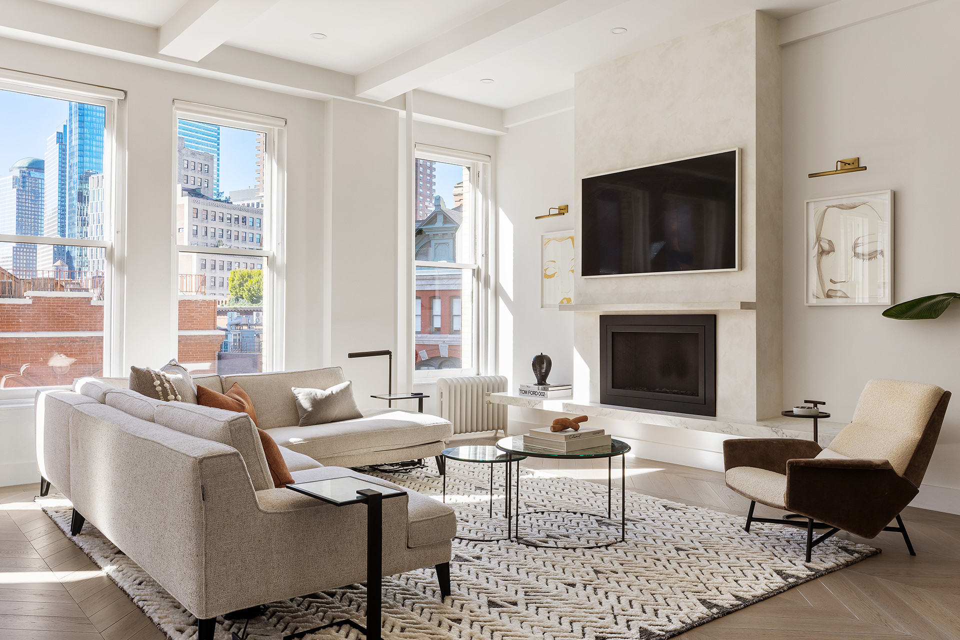 100 Hudson Street, Unit 7BC Manhattan, NY 10013 - Photo 3 of 20 a living room with furniture a flat screen tv and a fireplace