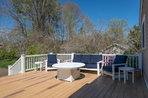 a view of a chairs and table on the deck