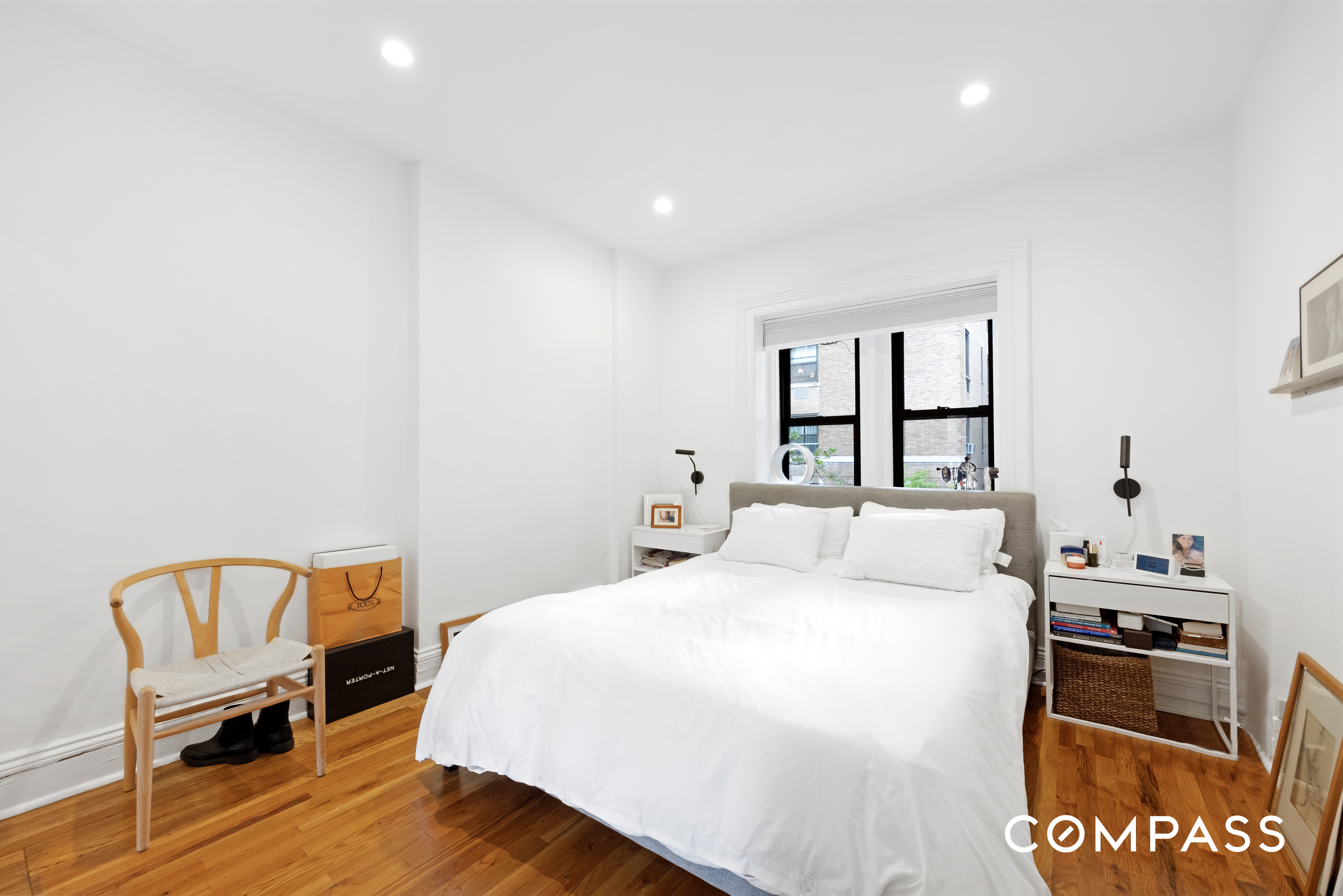 152 East 74th Street, Unit 2 Manhattan, NY 10021 - Photo 8 of 16 a bedroom with a bed and a chair