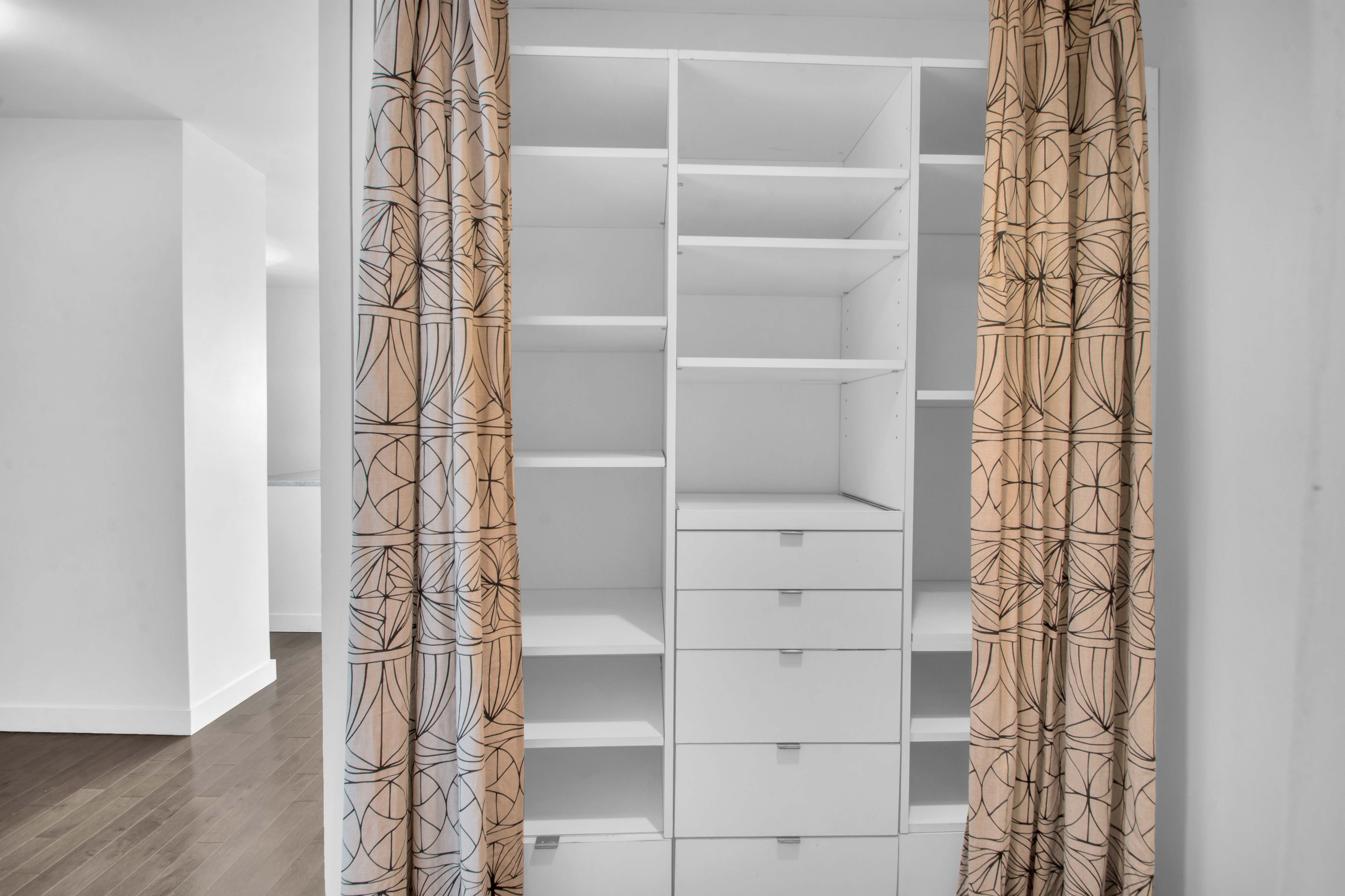 75 Henry Street, Unit 29J Brooklyn, NY 11201 - Photo 9 of 16 a view of walk in closet with empty racks