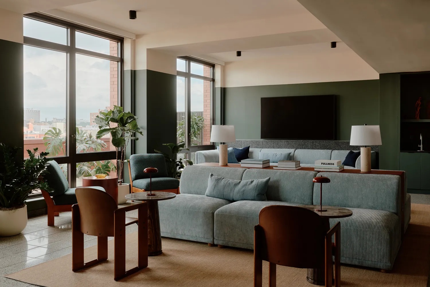 a living room with furniture window and wooden floor