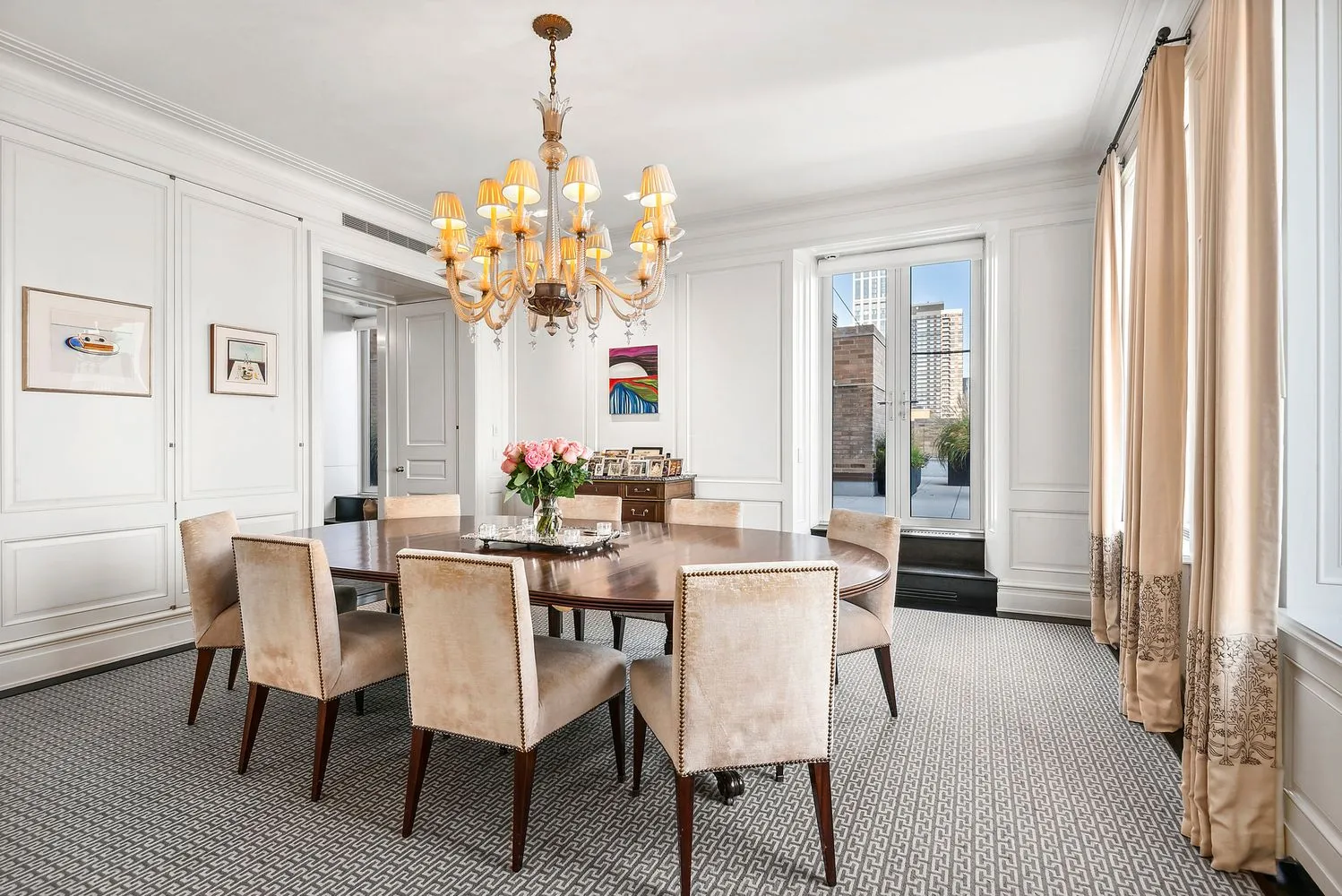a view of a dining room with furniture and window