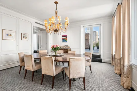 a view of a dining room with furniture and window