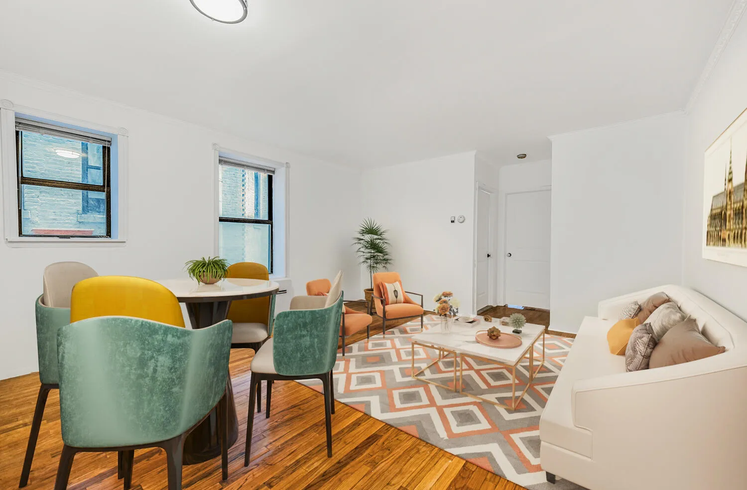 a view of a dining room with furniture and wooden floor